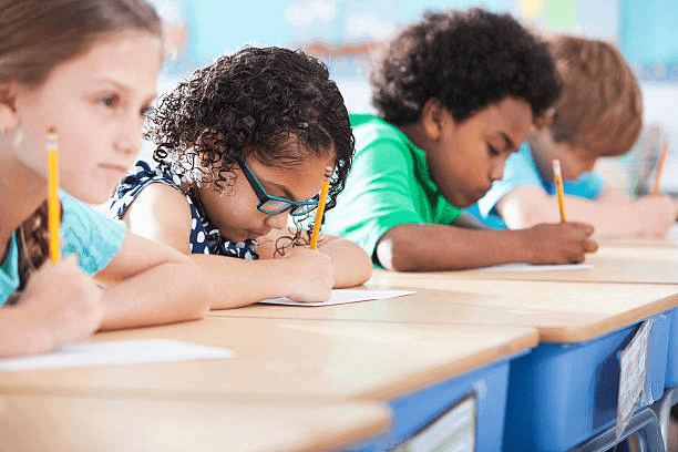 Student writing in a notebook